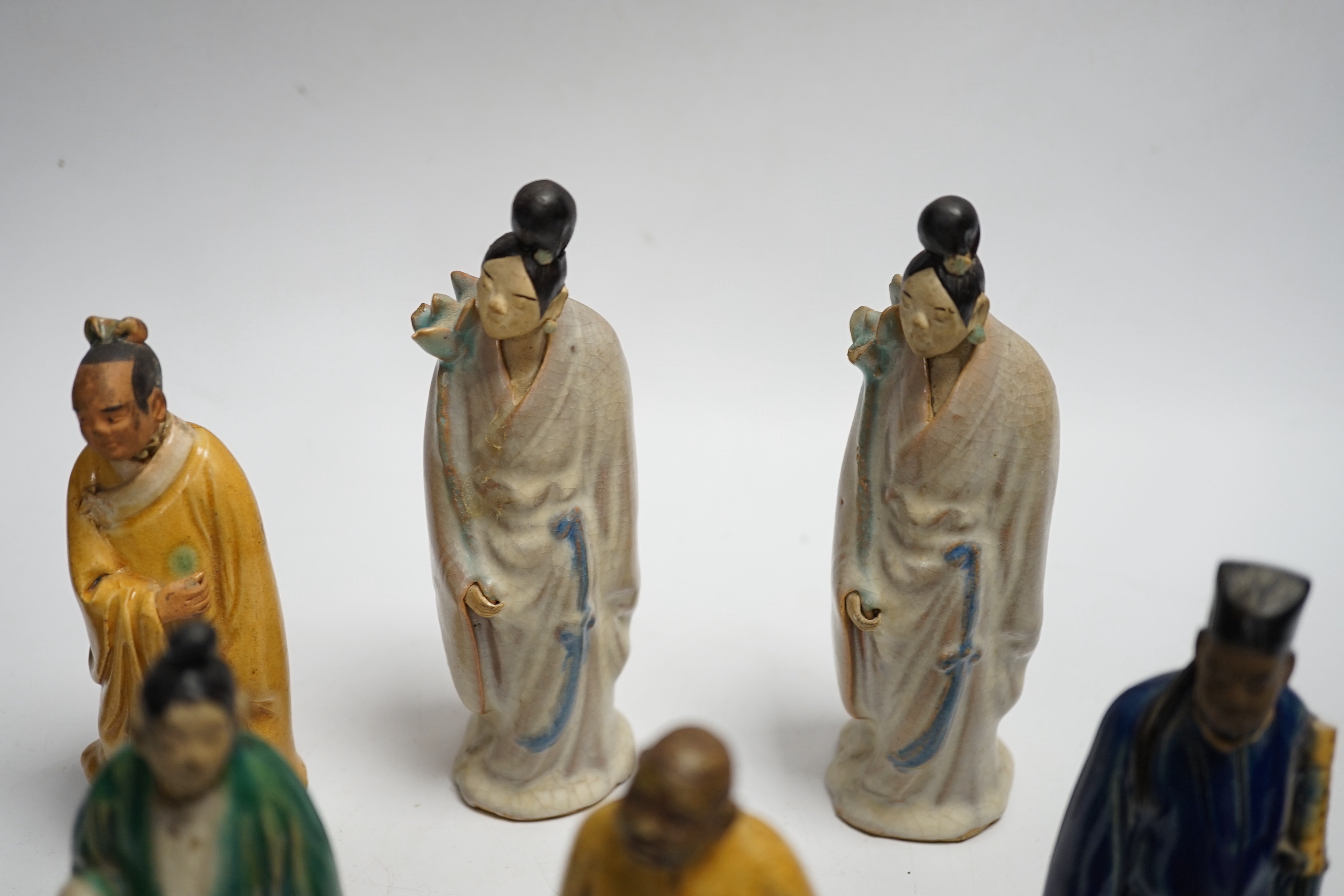Fifteen Chinese Shiwan-type glazed pottery figures and carved stone figures, early 20th century, tallest 15cm